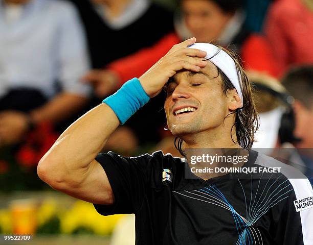 Spanish David Ferrer reacts after his victory against British Andy Murray during their Madrid Masters tennis match on May 14, 2010 at the Caja Magic...