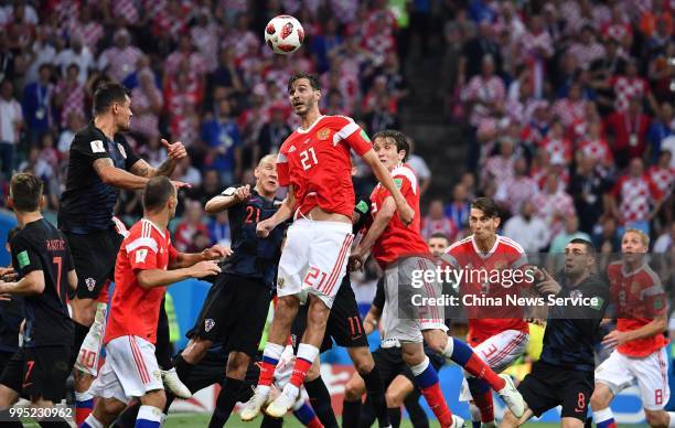 Aleksandr Yerokhin of Russia jumps up th head the ball during the 2018 FIFA World Cup Russia Quarter Final match between Russia and Croatia at Fisht...