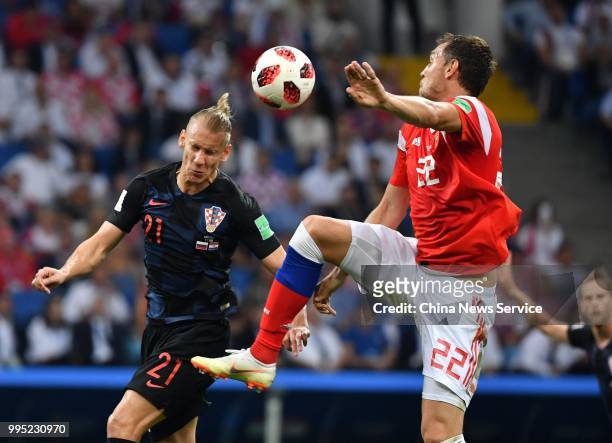 Domagoj Vida of Croatia and Artem Dzyuba of Russia vie for the ball during the 2018 FIFA World Cup Russia Quarter Final match between Russia and...