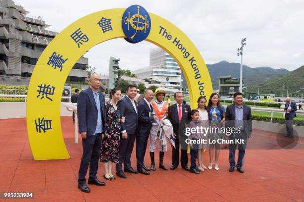 Jockey Joao Moreira, trainer Chris So Wai-yin and owners celebrate after Snowhooves winning Race 2 Wong Chuk Wan Handicap at Sha Tin racecourse on...