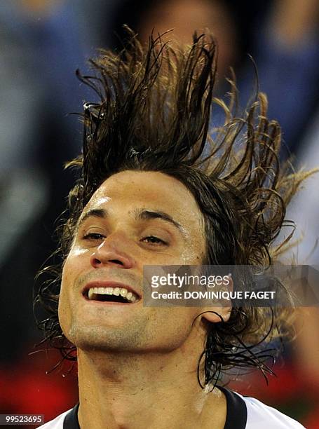 Spanish David Ferrer reacts after his victory against British Andy Murray during their Madrid Masters tennis match on May 14, 2010 at the Caja Magic...