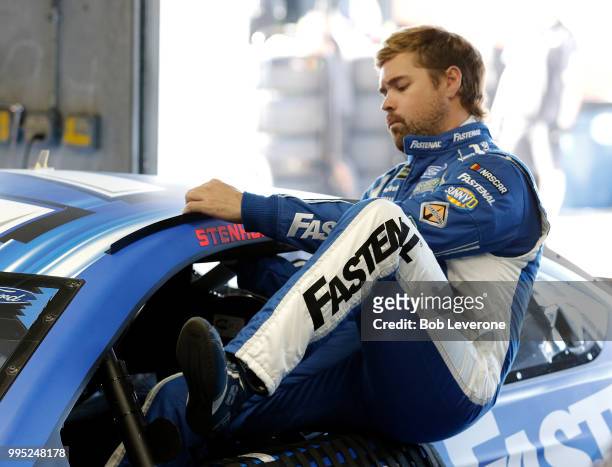 Ricky Stenhouse, Jr., climbs into his Roush Fenway car to start testing on The Roval at Charlotte Motor Speedway on July 10, 2018 in Charlotte, North...