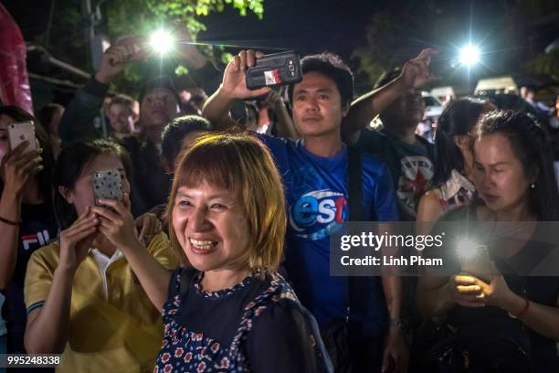 July 10: Onlookers at the junction in front of Chiangrai Prachanukroh Hospital watch and cheer as ambulances transport the last rescued schoolboys...