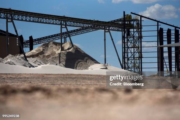 Conveyors stand above a sand pile at the Black Mountain Sand LLC Vest Mine in Winkler County, Texas, U.S., on Tuesday, June 19, 2018. In the West...