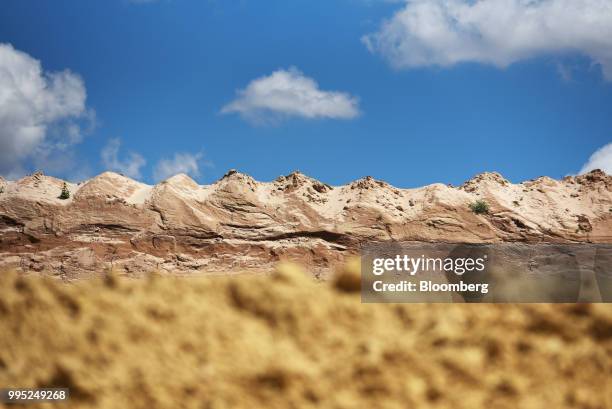 Sand piles stand at the Black Mountain Sand LLC Vest Mine in Winkler County, Texas, U.S., on Tuesday, June 19, 2018. In the West Texas plains,...