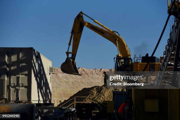 An excavator mines sand at the Black Mountain Sand LLC Vest Mine in Winkler County, Texas, U.S., on Wednesday, June 20, 2018. In the West Texas...