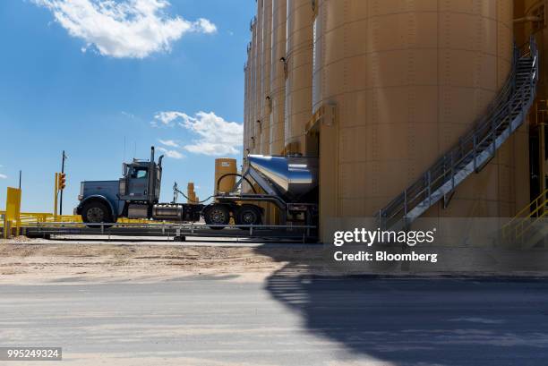 Semi truck is loaded with sand at the Black Mountain Sand LLC Vest Mine in Winkler County, Texas, U.S., on Tuesday, June 19, 2018. In the West Texas...