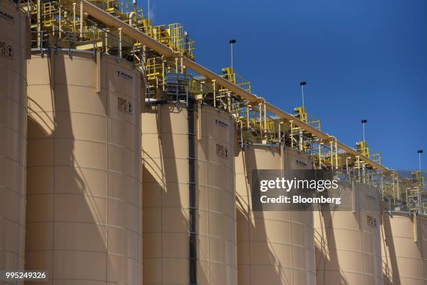 Silos stand at the Black Mountain Sand LLC Vest Mine in Winkler County, Texas, U.S., on Tuesday, June 19, 2018. In the West Texas plains, frack-sand...