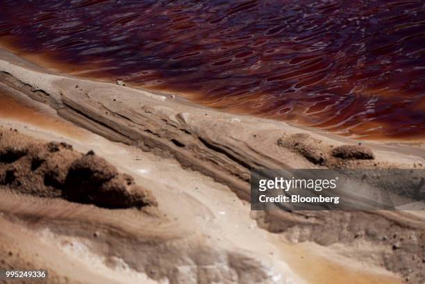 Water is seen along sand at the Black Mountain Sand LLC Vest Mine in Winkler County, Texas, U.S., on Tuesday, June 19, 2018. In the West Texas...