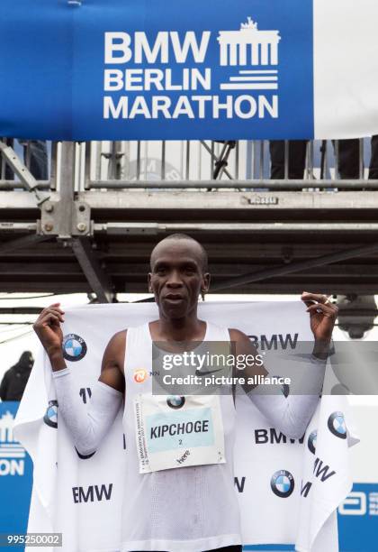 Eliud Kipchoge from Kenya poses in front of the Brandenburg Gate after winning the Berlin Marathon, in Berlin, Germany, 24 September 2017. Photo:...