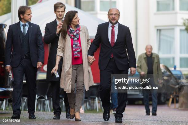 Chancellor candidate Martin Schulz and his wife Inge arrive at the city hall to cast their votes for the German Federal Election 2017 in Wuerselen,...