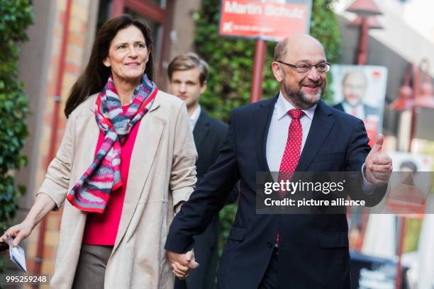 Chancellor candidate Martin Schulz and his wife Inge arrive at the city hall to cast their votes for the German Federal Election 2017 in Wuerselen,...