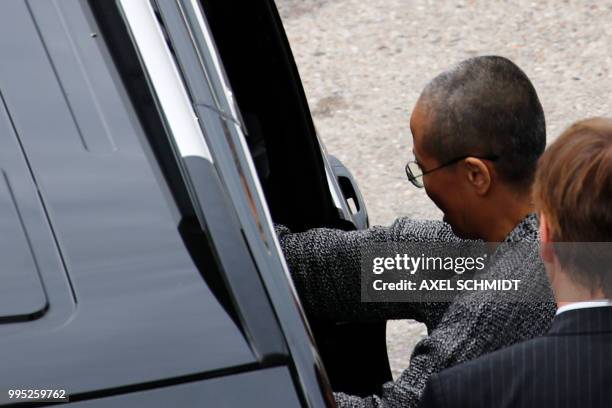 Liu Xia , the widow of Chinese Nobel Peace Prize laureate Liu Xiaobo, gets in to a car after she arrives at Tegel Airport in Berlin on July 10, 2018....