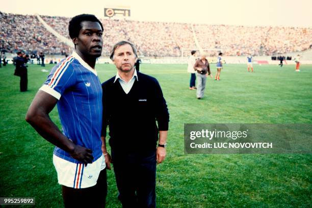 French team coach Michel Hidalgo gestures next to French player Marius Tresor at Gerland Stadium in Lyon, on May 17, 1982.