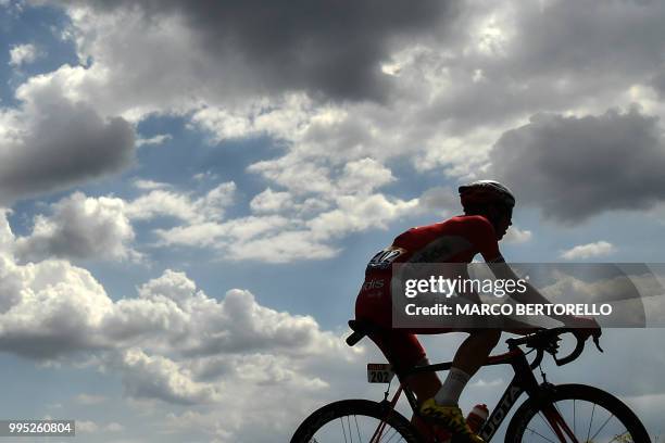 Belgium's Dimitri Claeys rides during a four-men breakaway in the fourth stage of the 105th edition of the Tour de France cycling race between La...