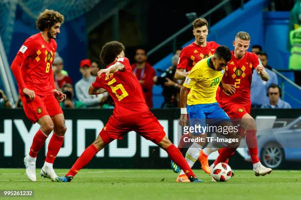 Axel Witsel of Belgium, Toby Alderweireld of Belgium and Roberto Firmino of Brazil battle for the ball during the 2018 FIFA World Cup Russia Quarter...