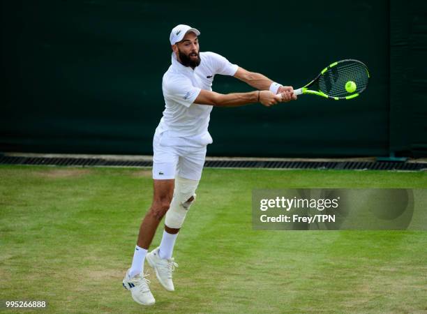 Benoit Paire of France in action against Juan Martin Del Potro of Argentina in the third round of the gentleman's singles at the All England Lawn...