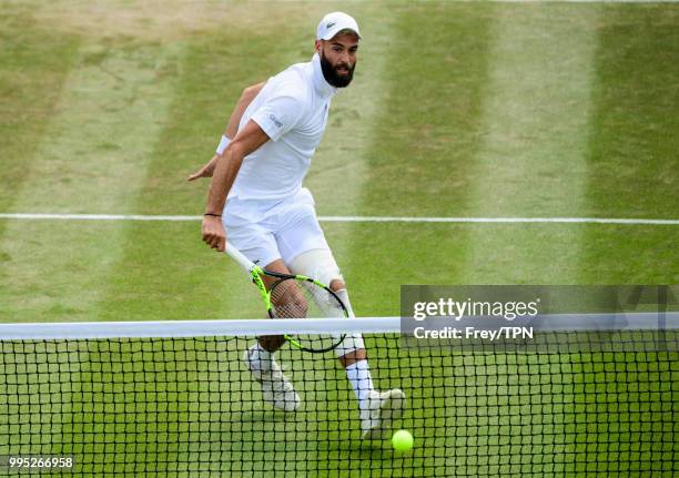 Benoit Paire of France in action against Juan Martin Del Potro of Argentina in the third round of the gentleman's singles at the All England Lawn...