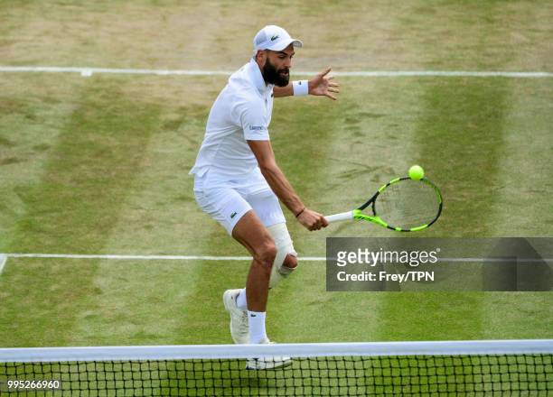 Benoit Paire of France in action against Juan Martin Del Potro of Argentina in the third round of the gentleman's singles at the All England Lawn...
