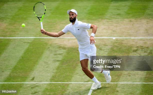 Benoit Paire of France in action against Juan Martin Del Potro of Argentina in the third round of the gentleman's singles at the All England Lawn...
