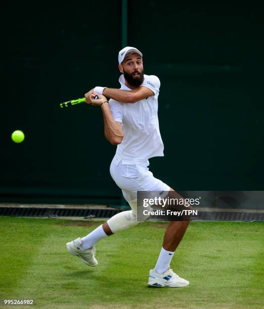 Benoit Paire of France in action against Juan Martin Del Potro of Argentina in the third round of the gentleman's singles at the All England Lawn...