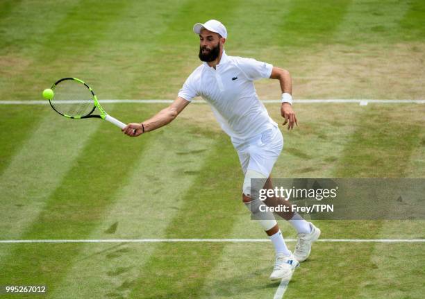 Benoit Paire of France in action against Juan Martin Del Potro of Argentina in the third round of the gentleman's singles at the All England Lawn...