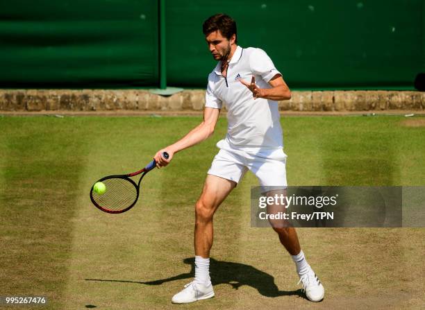 Gilles Simon of France in action against Mathew Ebden of Australia in the third round of the gentleman's singles at the All England Lawn Tennis and...