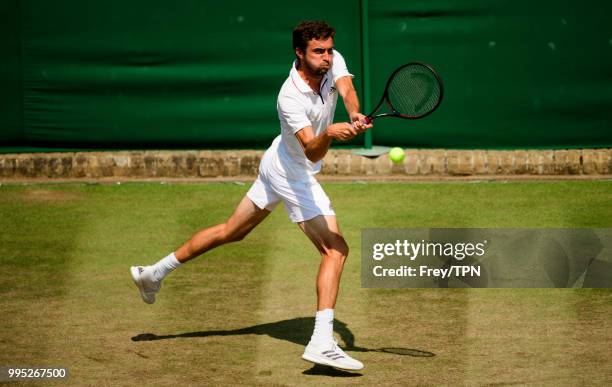 Gilles Simon of France in action against Mathew Ebden of Australia in the third round of the gentleman's singles at the All England Lawn Tennis and...