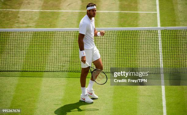 Juan Martin Del Potro of Argentina in action against Benoit Paire of France in the third round of the gentleman's singles at the All England Lawn...