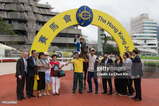 Jockey Zac Purton, trainer Paul O'Sullivan and owners celebrate after Amazing Moment winning Race 6 Shui Long Wo Handicap at Sha Tin racecourse on...