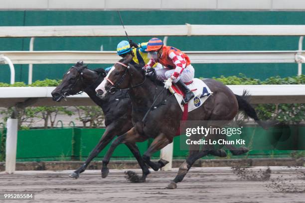 Jockey Karis Teetan riding Encore Boy wins Race 8 Lai Chi Chong Handicap at Sha Tin racecourse on July 8 , 2018 in Hong Kong.