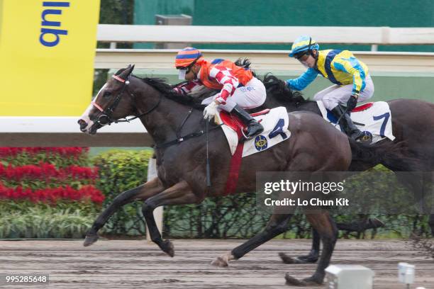 Jockey Karis Teetan riding Encore Boy wins Race 8 Lai Chi Chong Handicap at Sha Tin racecourse on July 8 , 2018 in Hong Kong.