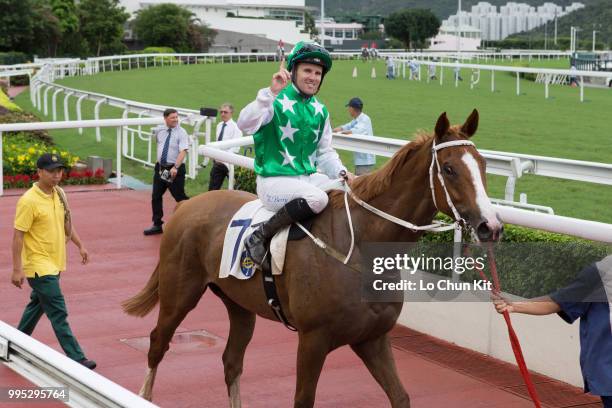 Jockey Tommy Berry riding Pakistan Friend wins Race 9 Tai Mong Tsai Handicap at Sha Tin racecourse on July 8 , 2018 in Hong Kong.