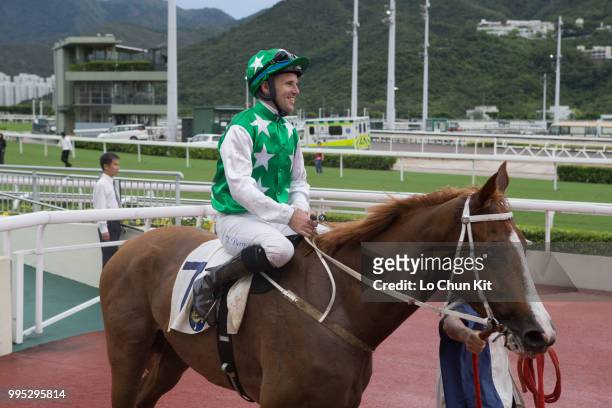 Jockey Tommy Berry riding Pakistan Friend wins Race 9 Tai Mong Tsai Handicap at Sha Tin racecourse on July 8 , 2018 in Hong Kong.