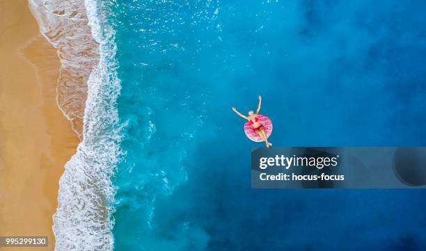 happy sunny day at beach on summer - pool raft imagens e fotografias de stock