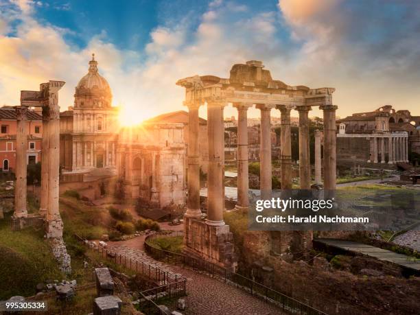 temple of vespasian and titus and church of santi luca e martina at forum romanum at sunrise, rome, lazio, italy - civilization stockfoto's en -beelden