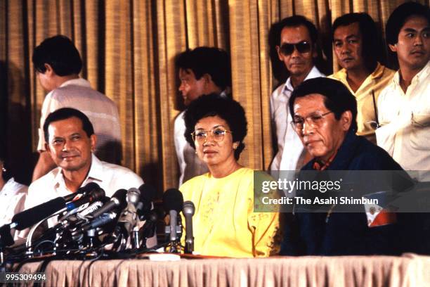 New Philippines President Corazon Aquino , Vice President Salvador Laurel and National Defense Minister Juan Ponce Enrile attend a press conference...