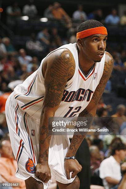 Tyrus Thomas of the Charlotte Bobcats rests on court against the Atlanta Hawks during the game on April 6, 2010 at the Time Warner Cable Arena in...