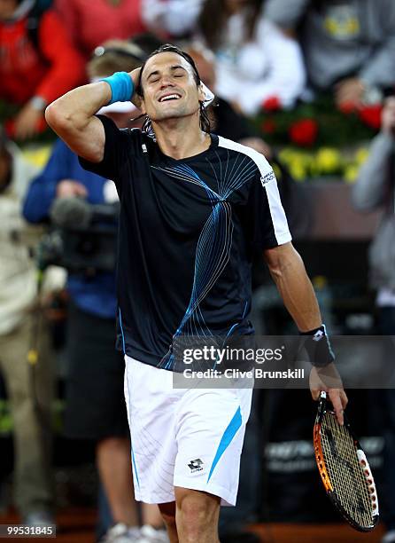 David Ferrer of Spain shows his delight after a straight sets victory against Andy Murray of Great Britain in their quarter final match during the...