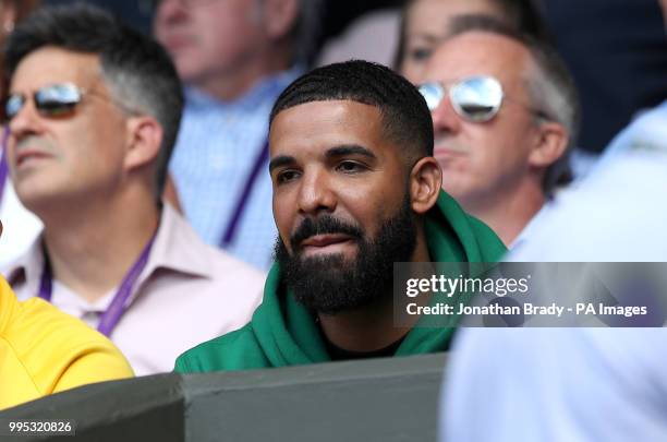 Drake in the stands of centre court watching Serena Williams in action on day eight of the Wimbledon Championships at the All England Lawn Tennis and...