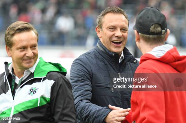 Hanover's sports director Horst Heldt , Hanover's head coach Andre Breitenreiter and Cologne's head coach Peter Stoeger before the German Bundesliga...
