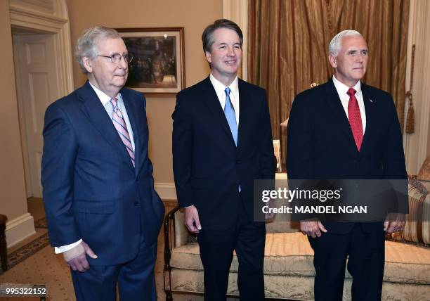 Senate Majority Leader Mitch McConnell,Supreme Court associate justice nominee Brett Kavanaugh and US Vice President Mike Pence pose in McConnell's...