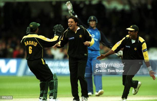 Shahid Afridi of Pakistan with Waqar Younis and Rashid Latif after the wicket of Mark Ealham during the Natwest Series One Day match between England...