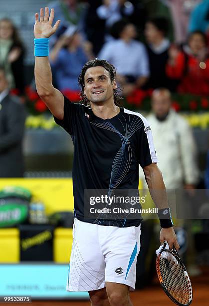 David Ferrer of Spain shows his delight after a straight sets victory against Andy Murray of Great Britain in their quarter final match during the...