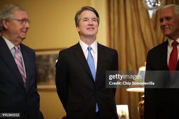 Judge Brett Kavanaugh poses for photographs with Vice President Mike Pence and Senate Majority Leader Mitch McConnell before a meeting in McConnell's...