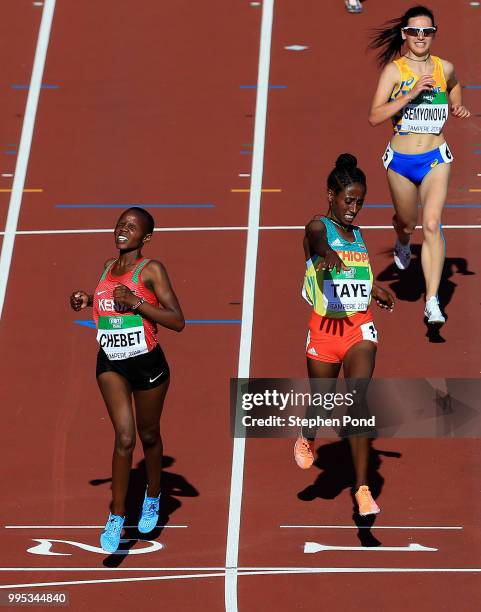 Beatrice Chebet of Kenya crosses the finish line ahead of Ejgayehu Taye of Ethiopia to win the women's 5000m final during day one of The IAAF World...