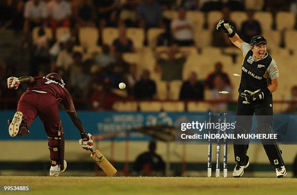 New Zealand cricketer Rachel Priest reacts as West Indies cricketer Stafanie Taylor is run out during the Women's ICC World Twenty20 second semifinal...