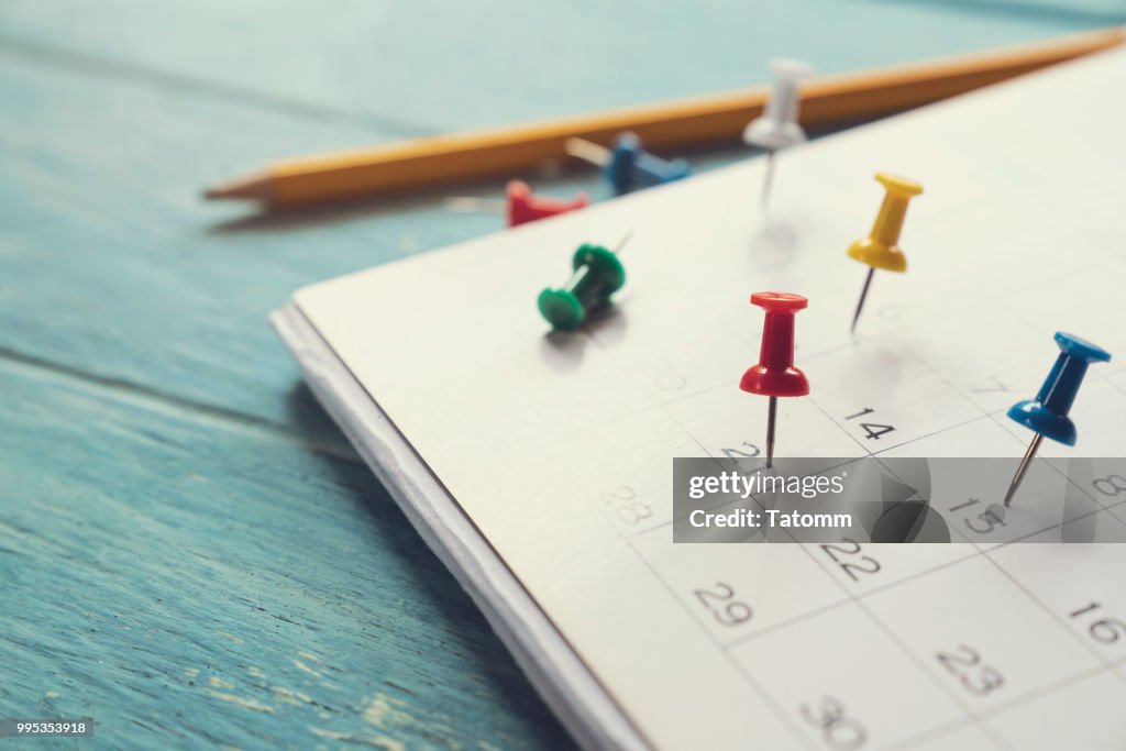 Close up of calendar on the table, planning for business meeting or travel planning concept