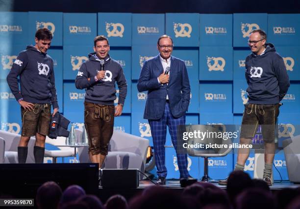 Actor Kevin Spacey standing between founders Andreas Bruckschloegl , Felix Haas and Bernd Storm van's Gravesande at the Bits and Pretzels founders'...