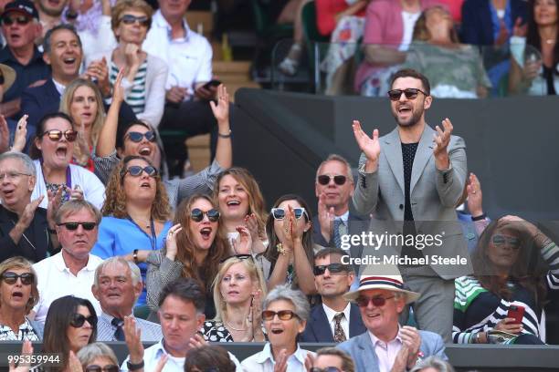 Justin Timberlake applauds a shot played by Serena Williams of the United States during her Ladies' Singles Quarter-Finals match against Camila...